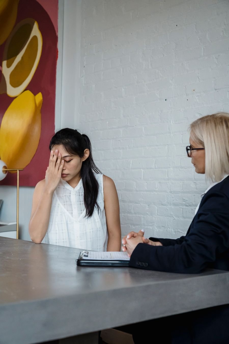 A woman speaking with a counselor