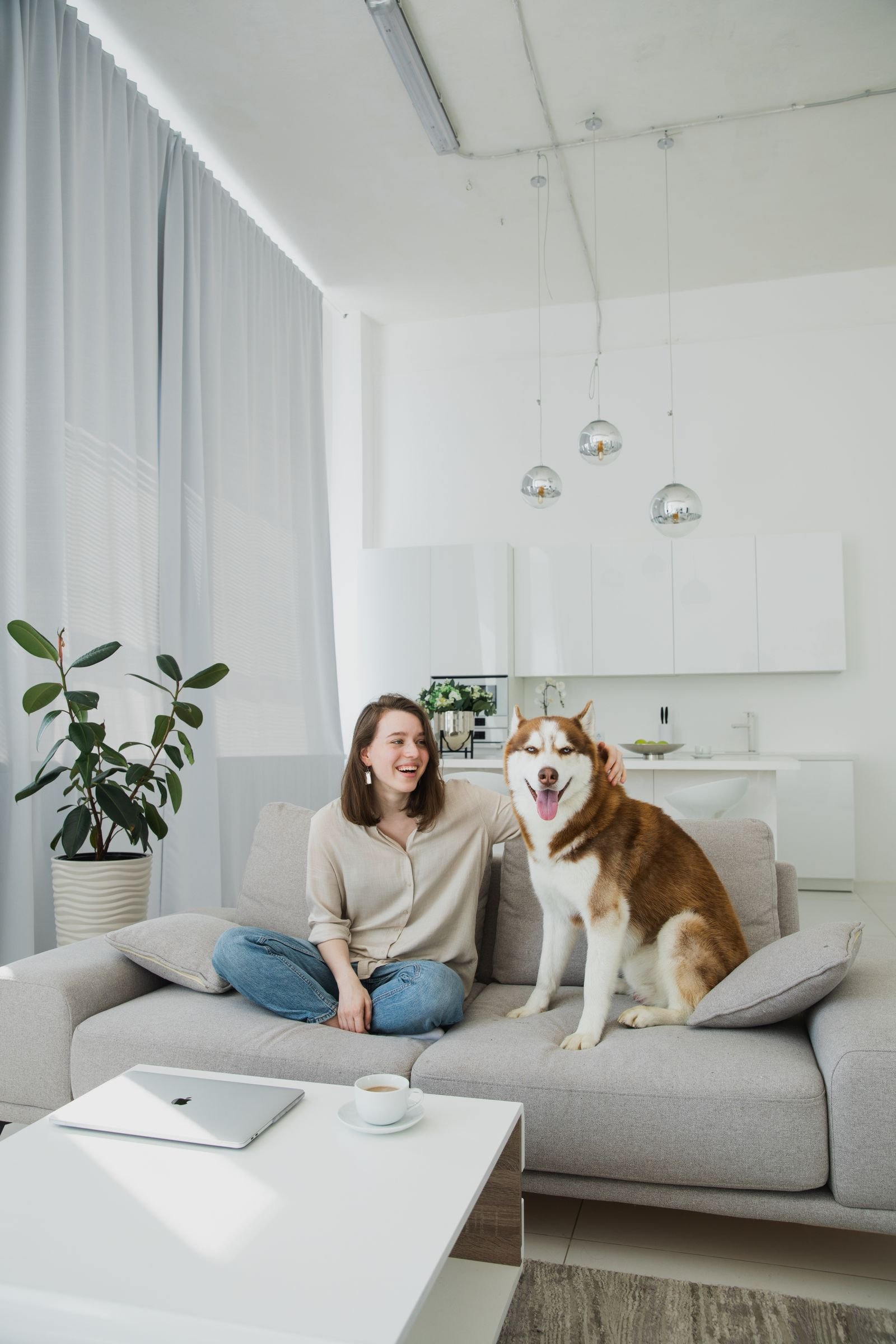A woman spending time with her dog at home